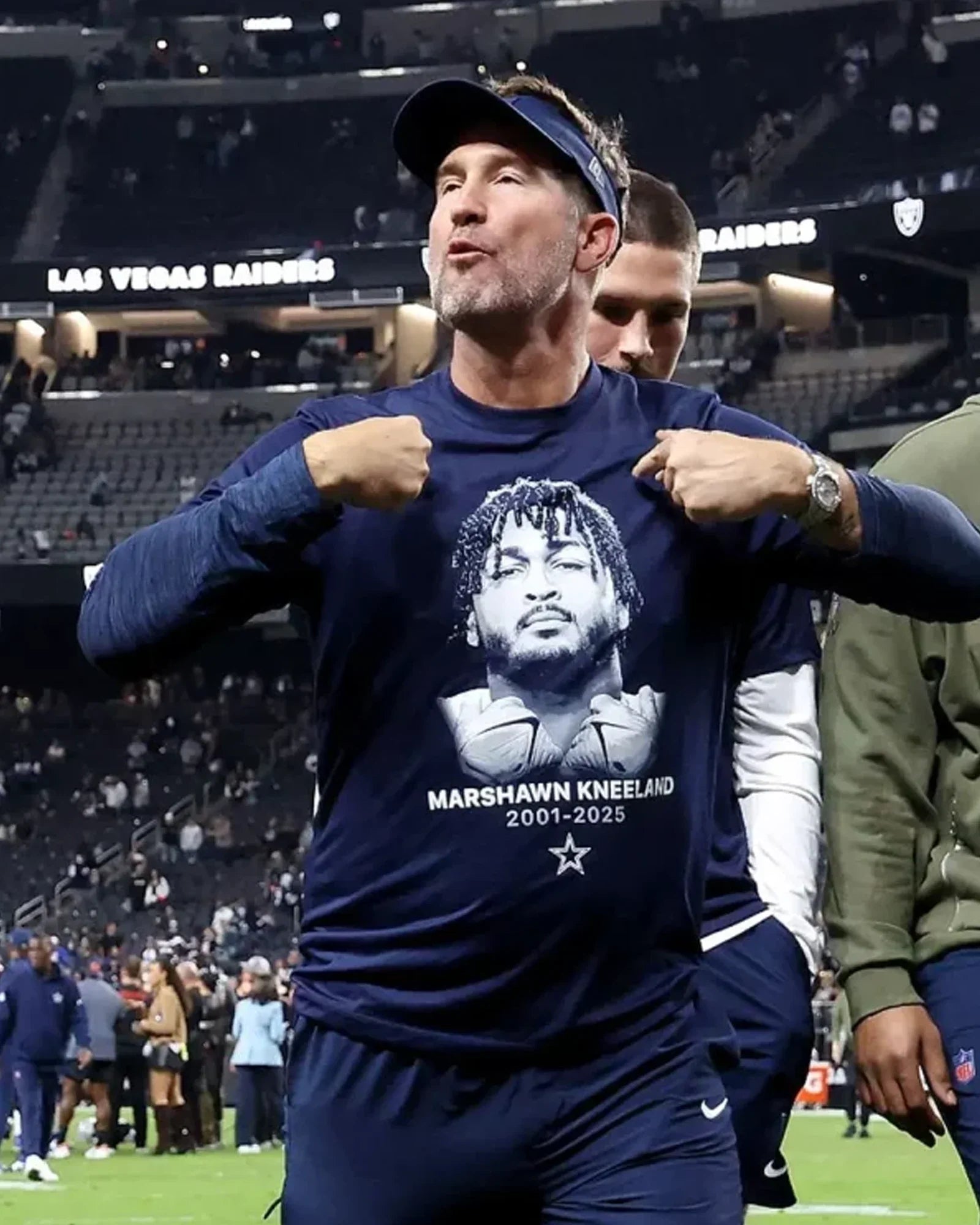 Brian-Schottenheimer-Marshawn-Kneeland-T-Shirt-Blue